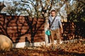 gardener working with leaf blower, vacuum and industrial tools