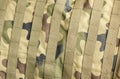 Professional generic green army military camo camouflage textile material with straps, full frame simple background texture, top Royalty Free Stock Photo