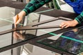 The glazier cuts the glass in the glass factory, the cutter and the glass angle Royalty Free Stock Photo