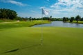 Professional golf course. Green field with trees, grass and lake. Royalty Free Stock Photo