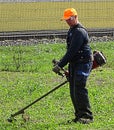 Grass Cutter Man Worker on the Field