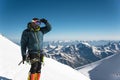 Professional guide - climber on the snow-covered summit of Elbrus sleeping volcano Royalty Free Stock Photo