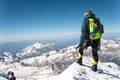 Professional guide - climber on the snow-covered summit of Elbrus sleeping volcano Royalty Free Stock Photo
