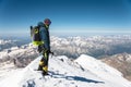 Professional guide - climber on the snow-covered summit of Elbrus sleeping volcano Royalty Free Stock Photo