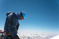 Professional guide - climber on the snow-covered summit of Elbrus sleeping volcano Royalty Free Stock Photo