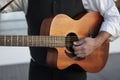 Professional guitarist plays guitar outdoors. Royalty Free Stock Photo