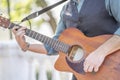 Professional guitarist plays guitar outdoors. Royalty Free Stock Photo