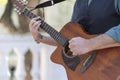 Professional guitarist plays guitar outdoors Royalty Free Stock Photo