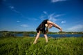 Young professional gymnast posing with ball Royalty Free Stock Photo