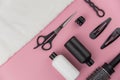 Professional hair dresser tools with copy space. Hair stylist equipment set on pink background. Royalty Free Stock Photo