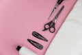 Professional hair dresser tools with copy space. Hair stylist equipment set on pink background. Royalty Free Stock Photo