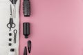 Professional hair dresser tools with copy space. Hair stylist equipment set on pink background. Royalty Free Stock Photo