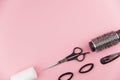 Professional hair dresser tools with copy space. Hair stylist equipment set on pink background. Royalty Free Stock Photo