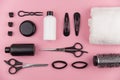 Professional hair dresser tools with copy space. Hair stylist equipment set on pink background. Royalty Free Stock Photo