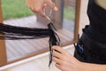 Professional hairdresser cutting woman`s hair in beauty salon, closeup Royalty Free Stock Photo