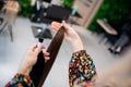 Professional hairdresser demonstrating hair samples for extension in beauty salon