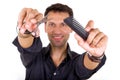 Professional hairdresser holding scissors and comb Royalty Free Stock Photo