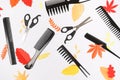 Professional hairdresser tools hairbrushes with autumn paper leaves on white background Royalty Free Stock Photo