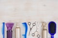 Professional hairdresser tools on wooden surface with copyspace at top Royalty Free Stock Photo