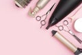 Professional hairdressing tools on pink background with copy space Royalty Free Stock Photo