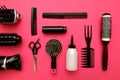 Professional hairdressing tools on pink background Royalty Free Stock Photo