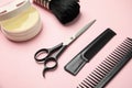 Professional hairstyling tools on pink background