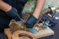 Professional hands chef with gloves slicing iberico spanish ham in restaurant event party