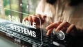 Professional hands typing on keyboard with digital interface displaying scalable systems concept for modern technology Royalty Free Stock Photo