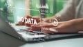 Professional Hands Typing on Laptop with Big Data Graphics and Digital Elements Representing Technology and Information Royalty Free Stock Photo