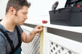 Professional handyman assembling radiator cabinet Royalty Free Stock Photo