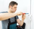 Professional handyman fixing window Royalty Free Stock Photo