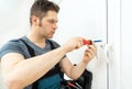 Professional handyman fixing window Royalty Free Stock Photo