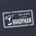 Professional Handyman. High quality service logo. Stamp of handyman service. Frame with dry rough edges on dark brick wall.