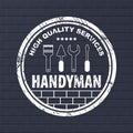 Professional handyman services logo. Stamp handyman services on dark bricks background. Stamp with dry rough edges Royalty Free Stock Photo