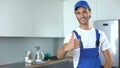 Professional handyworker showing thumbs up, ad of high-quality home repairs