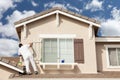 Professional House Painter Painting the Trim And Shutters of A H Royalty Free Stock Photo