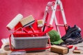 Professional house painter, tools and work equipment. On an antique wooden table Royalty Free Stock Photo