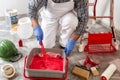 Professional house painter at work prepares the wall paint Royalty Free Stock Photo