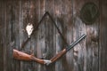 Professional hunters equipment for hunting. Rifle, Deer, Roe deer trophy sculs and others on a wooden black background. Trophy scu Royalty Free Stock Photo