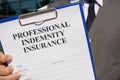 Professional indemnity insurance is shown using the text Royalty Free Stock Photo