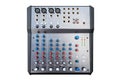 A professional 8-input sound mixer with many adjustments and knob switches, isolated on a white background with a clipping path. Royalty Free Stock Photo