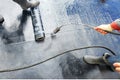 Professional installation of waterproofing on the concrete foundation Two worker at construction site Royalty Free Stock Photo
