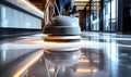 Professional janitorial staff using an industrial floor buffer machine for cleaning and polishing the hallway of a modern