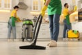 Professional janitors working in kitchen, closeup. Cleaning service Royalty Free Stock Photo