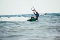 Professional kiter makes the difficult trick on a beautiful background.