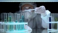 Professional lab worker pouring liquid in test tube, illegal experiments, crime Royalty Free Stock Photo