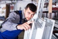 Professional labour with finished PVC profiles and windows at factory Royalty Free Stock Photo