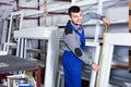 Professional labour with finished PVC profiles and windows at factory Royalty Free Stock Photo
