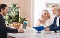 Professional lawyer working with aged couple in the house Royalty Free Stock Photo