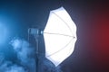 Professional lighting equipment with fume on dark background